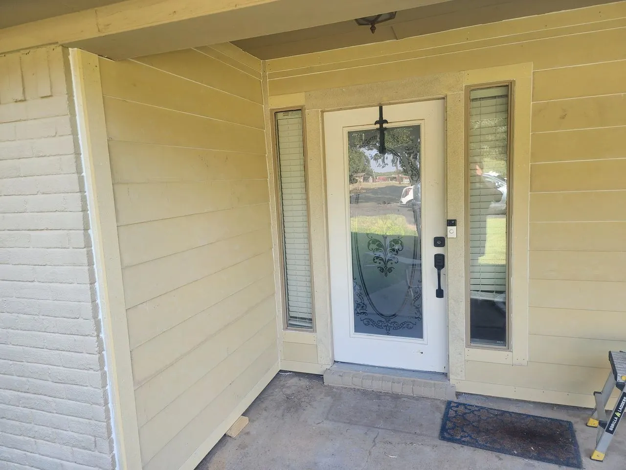 Ad Lib Family Construction siding: 03 entry with painted brick