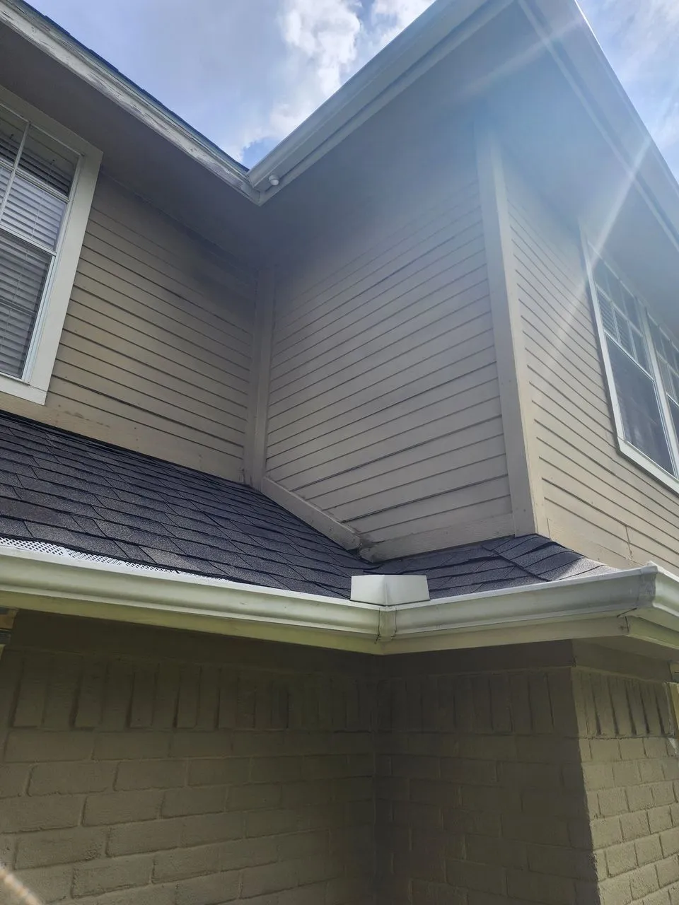 Ad Lib Family Construction fascia & soffit repair: 05 white fascia dark shingle