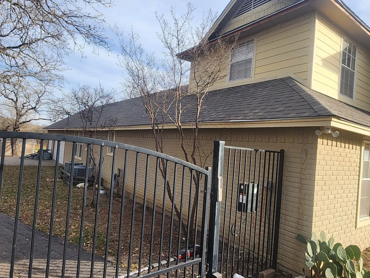 Ad Lib Family Construction fencing: 10 ornamental iron gate