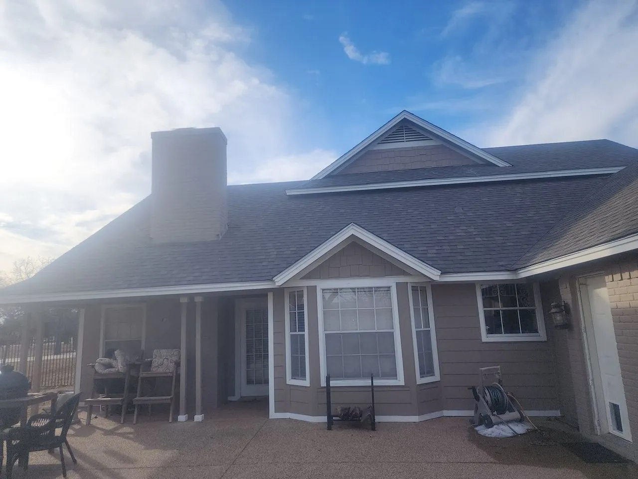 Ad Lib Family Construction exteriors: 11 shingle roof covered porch